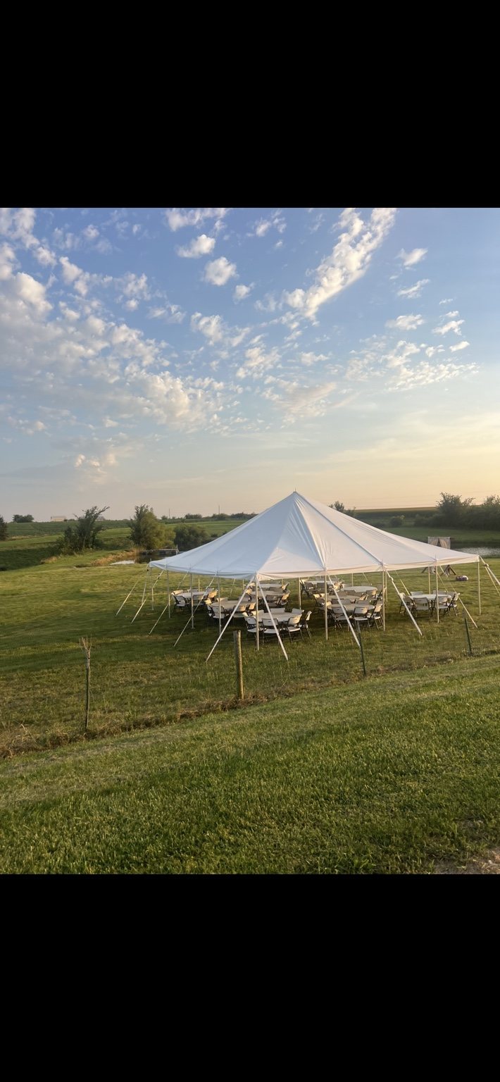 Event tent setup at sunset